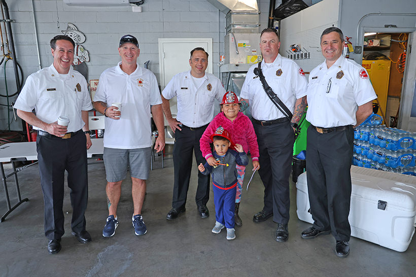 Fire department staff with children Fire department staff with children